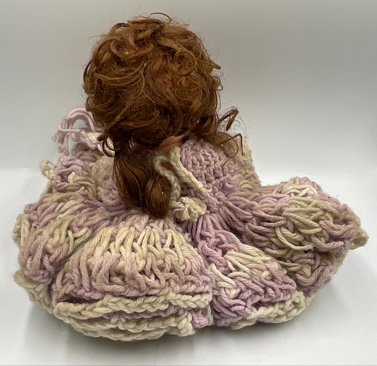Vintage doll featuring a custom, handmade crochet dress and bonnet