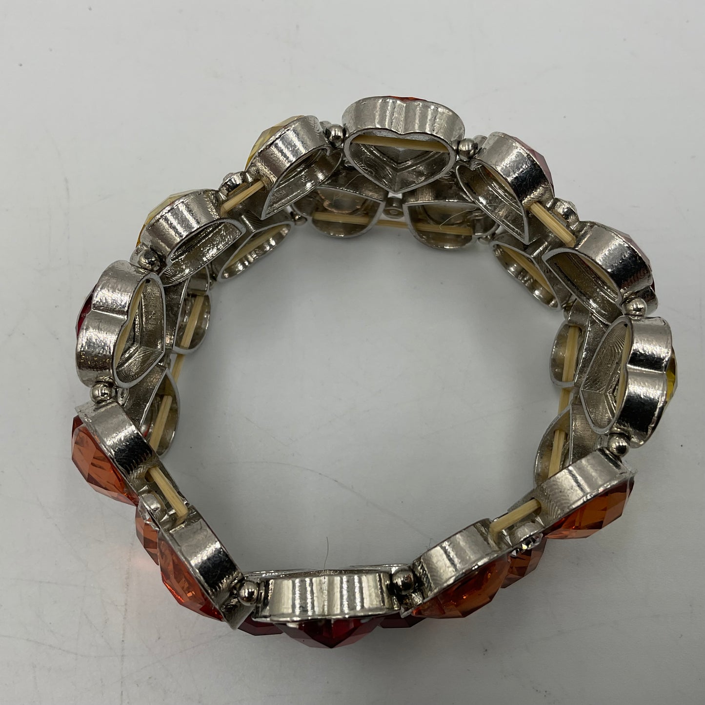 Silver Toned Bracelet With Colored Heart Shaped Stones