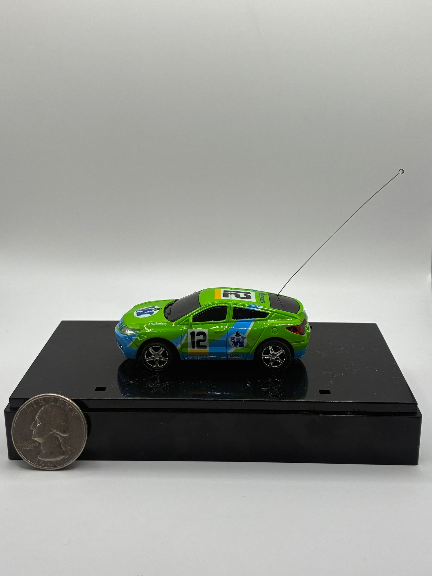 Westminister World's Smallest RC Car #12 Green Diecast 1:64 Size in Acrylic Case.