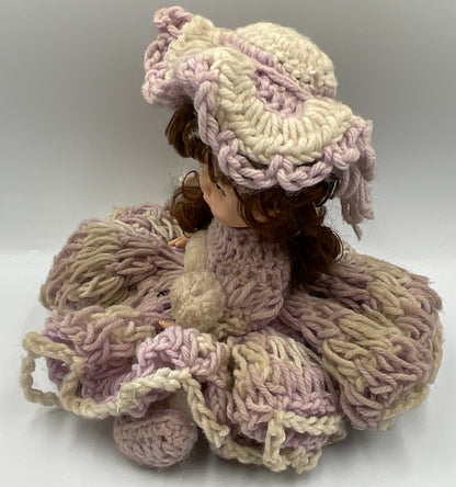 Vintage doll featuring a custom, handmade crochet dress and bonnet