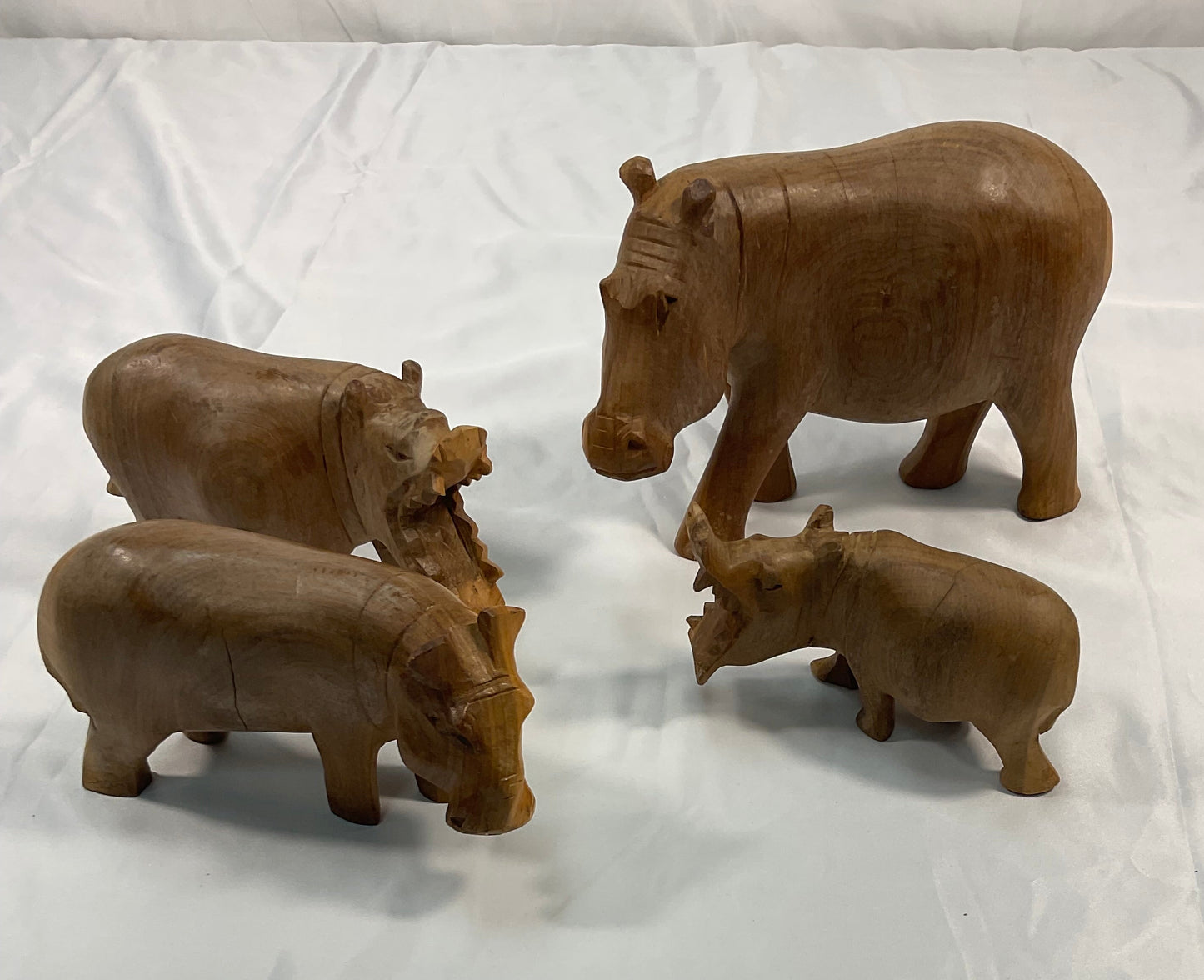 Genuine Besmo Wood Carvings Set of Four Hand-Carved Wooden Hippos Made in Kenya