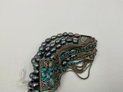 Silverstone Multi Strand Bracelet With Teal Colored Stones