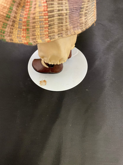 Vintage Porcelain Doll With a Red Beanie and Coat