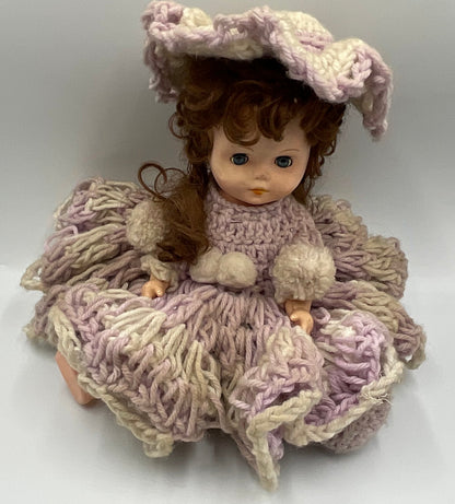 Vintage doll featuring a custom, handmade crochet dress and bonnet