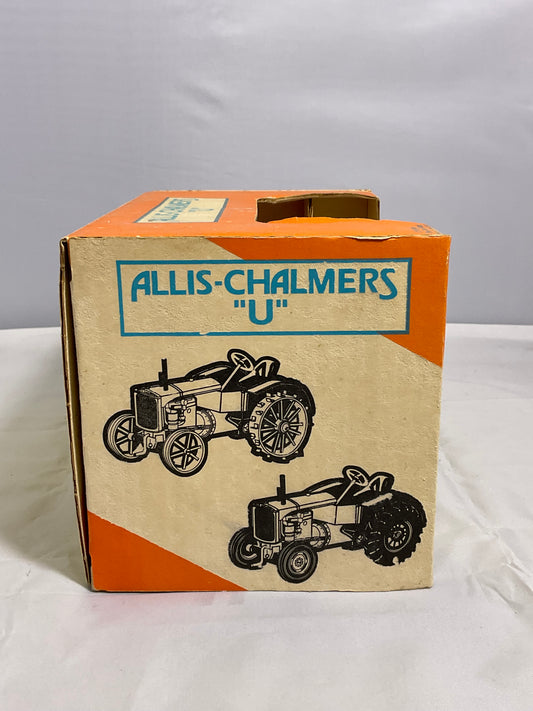 Cardboard box with Allis-Chalmers branding and tractor illustrations on a white background