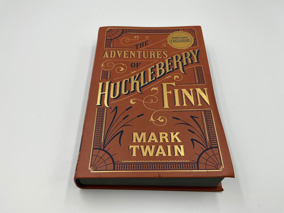 “The Adventures of Huckleberry Finn” by Mark Twain