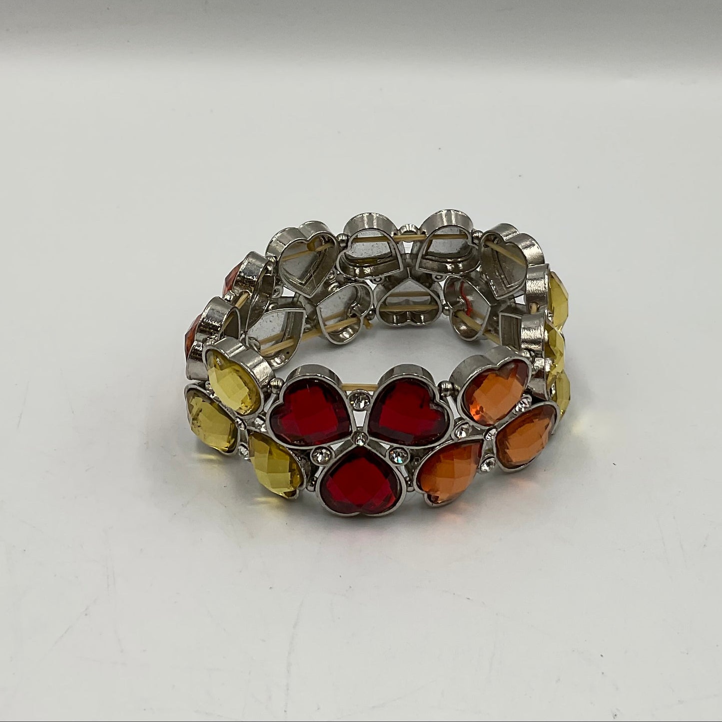 Silver Toned Bracelet With Colored Heart Shaped Stones