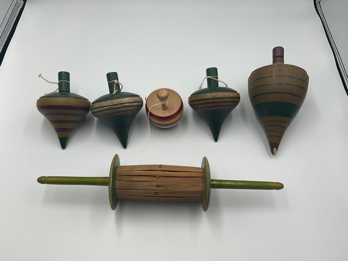 of vintage hand-turned wooden spinning tops