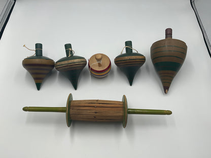 of vintage hand-turned wooden spinning tops