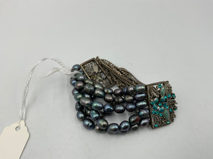 Silverstone Multi Strand Bracelet With Teal Colored Stones