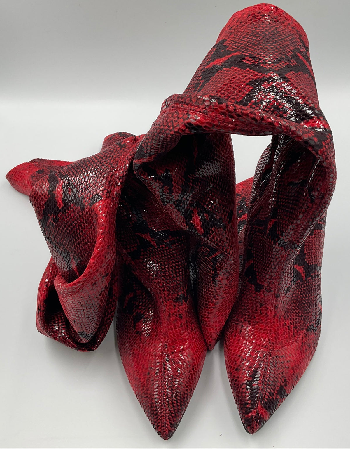 Mei Oi snakeskin-pattern over-the-knee boots