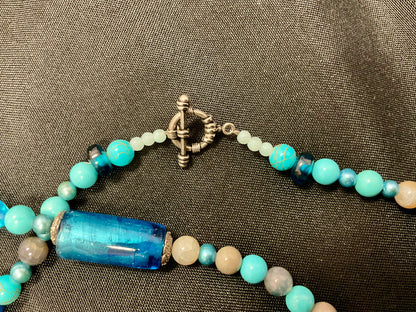 Light and Dark Blue Beaded Necklace with Elongated Heart Shaped Pendant Copper-Tone Bar and Toggle Clasp 22 Inches Length