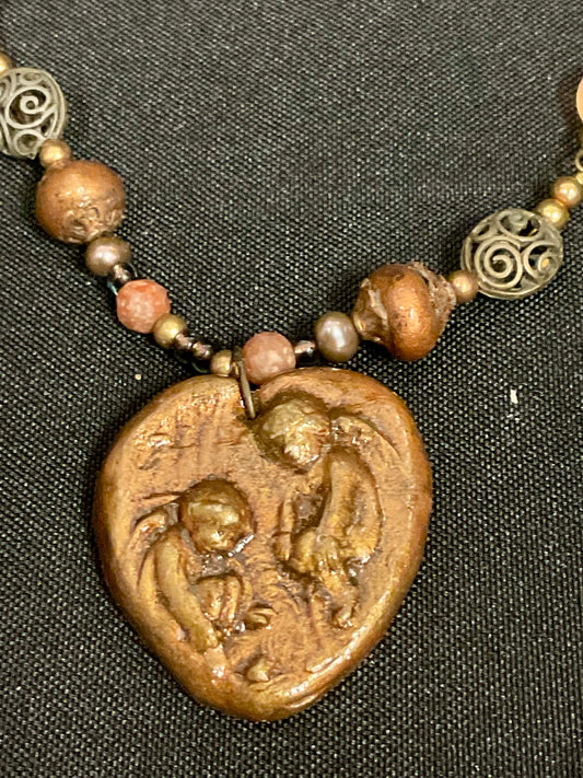 Brown Beaded Necklace with Fossil Angels Pendant