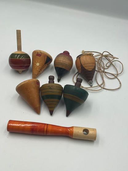 of vintage hand-turned wooden spinning tops