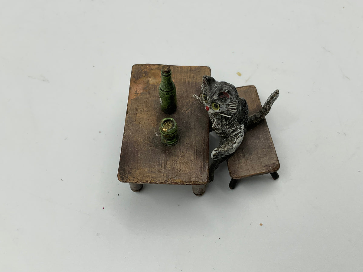 Miniature Cat Drinking at Table collectible figurine