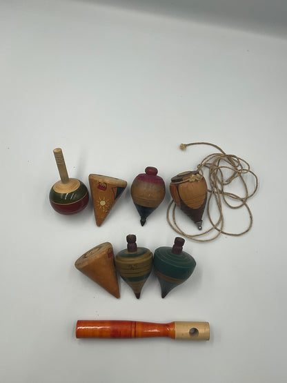 of vintage hand-turned wooden spinning tops