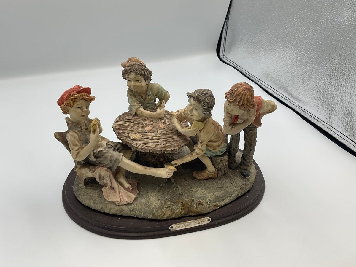 vintage resin sculpture titled "The Cheats" (or "The Cheaters") from the Misubanti Collection