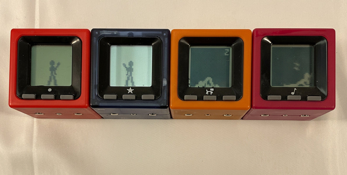 Radica Cube World Set of 4 Vintage Handheld Electronic Games Toys Working New Batteries