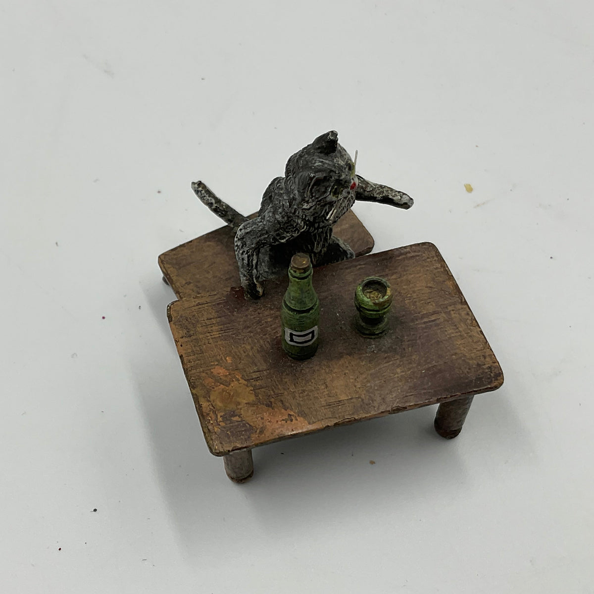 Miniature Cat Drinking at Table collectible figurine