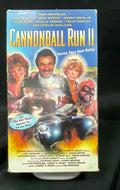 VHS tape of 'Cannonball Run II' on a black background