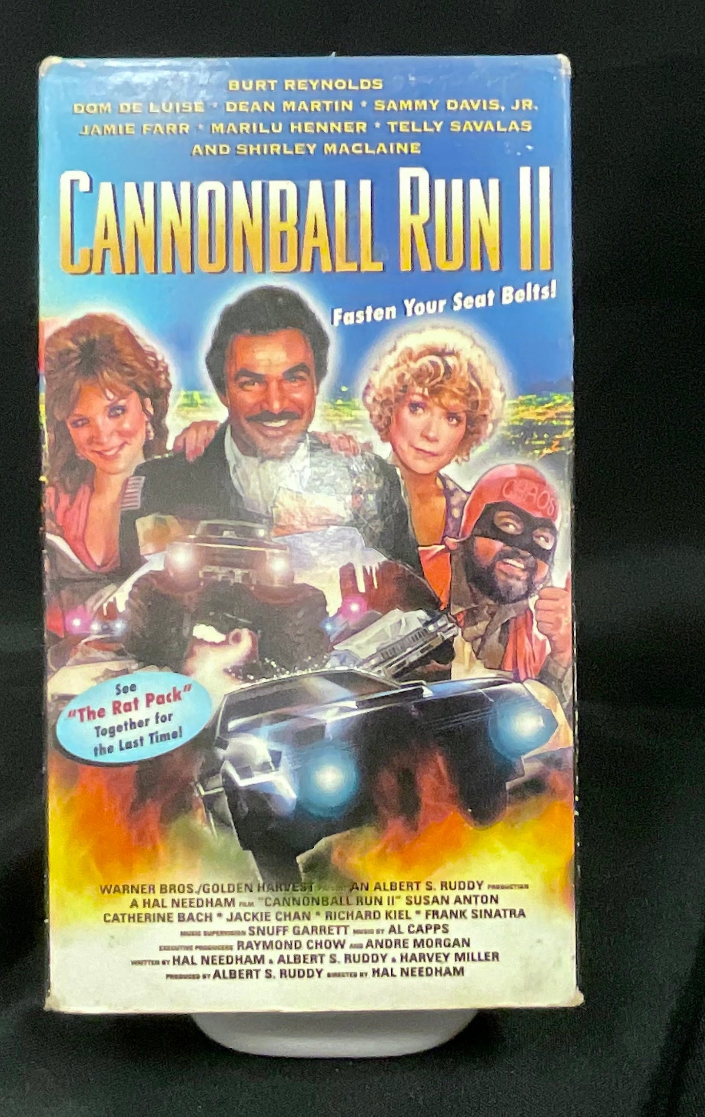 VHS tape of 'Cannonball Run II' on a black background