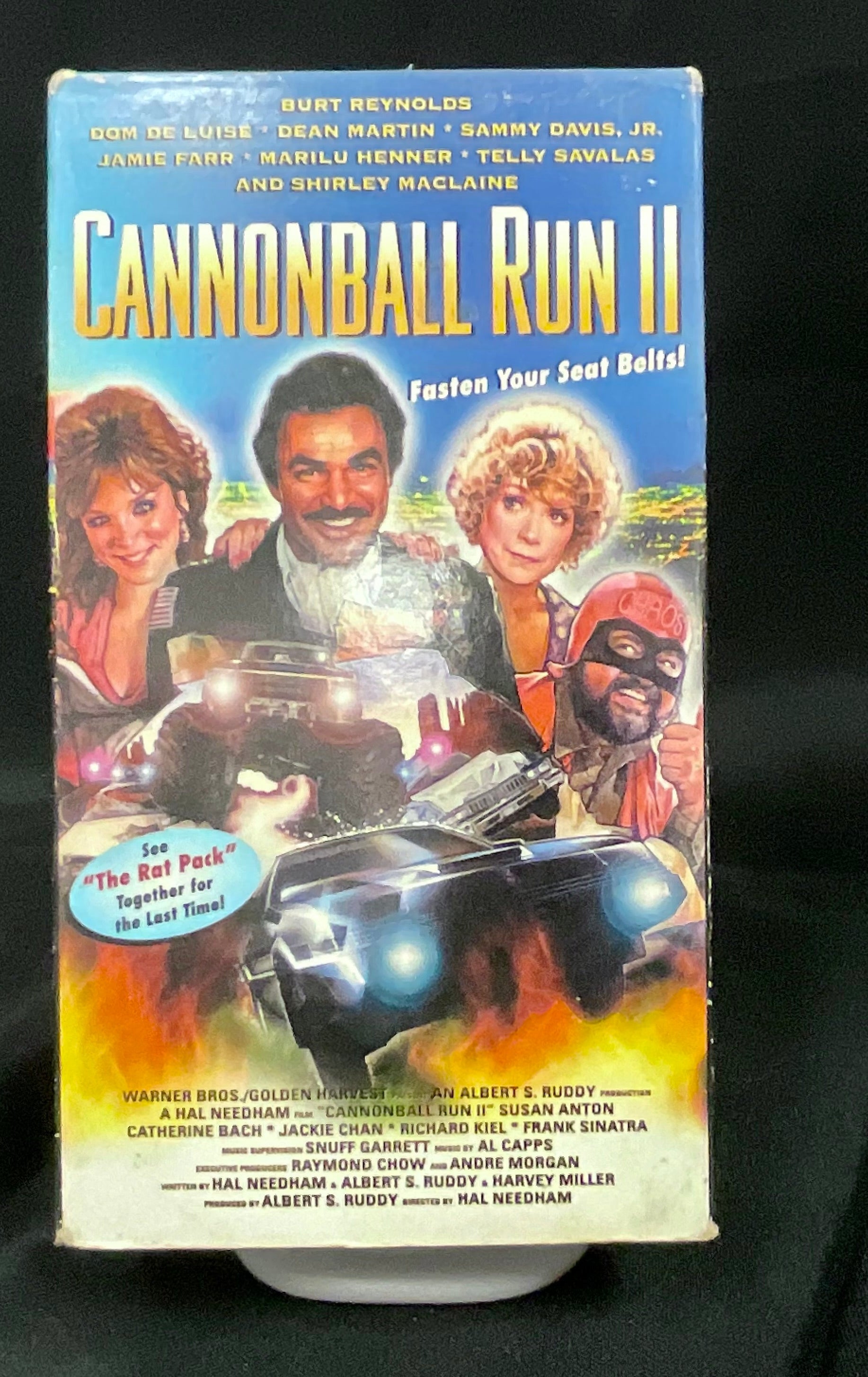 VHS tape of 'Cannonball Run II' on a black background