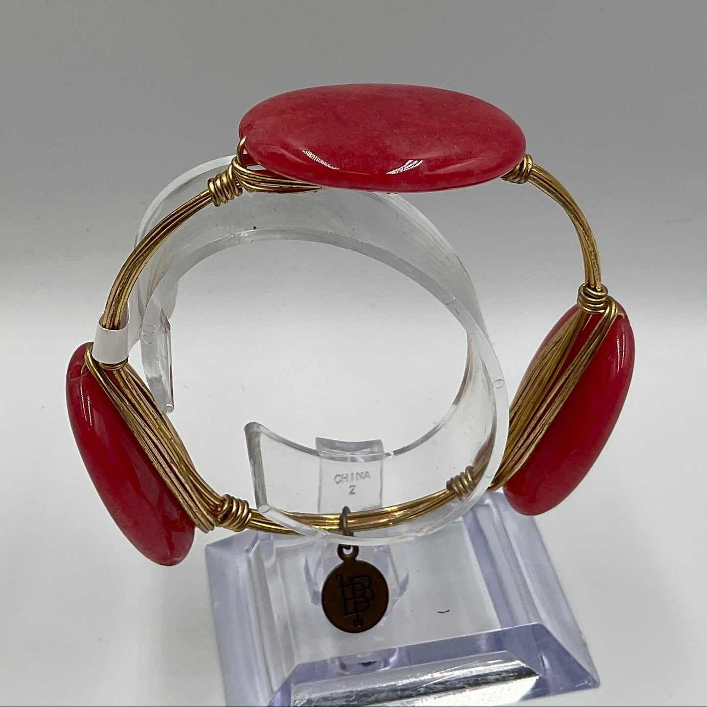 Bourbon and Boweties Gold Tone Wire Bangle Large Pink Stones