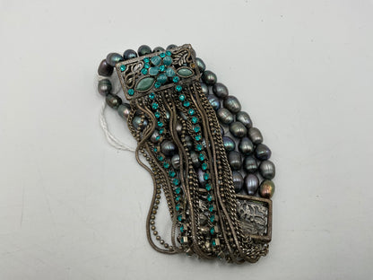 Silverstone Multi Strand Bracelet With Teal Colored Stones