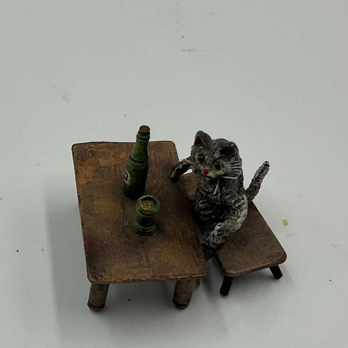 Miniature Cat Drinking at Table collectible figurine