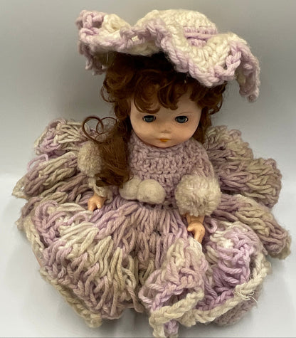 Vintage doll featuring a custom, handmade crochet dress and bonnet