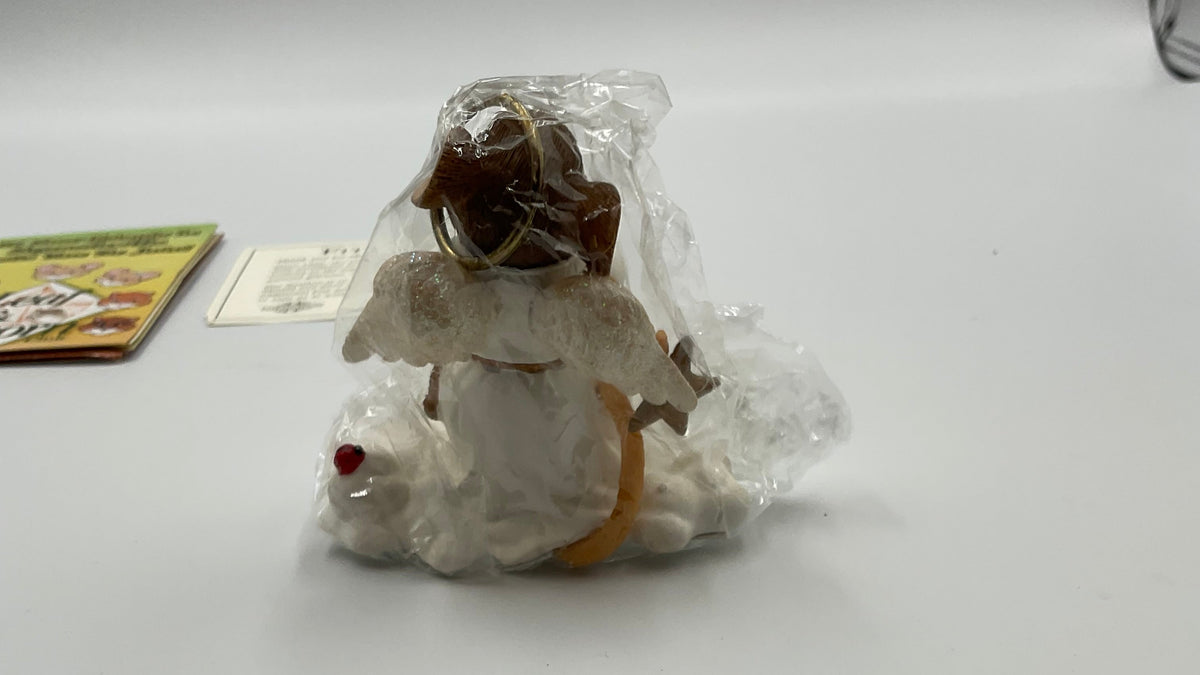 Collectible figurine kit from the Charming Tails collection by Fitz and Floyd