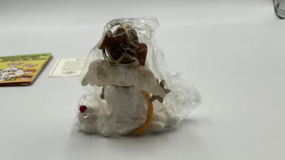 Collectible figurine kit from the Charming Tails collection by Fitz and Floyd