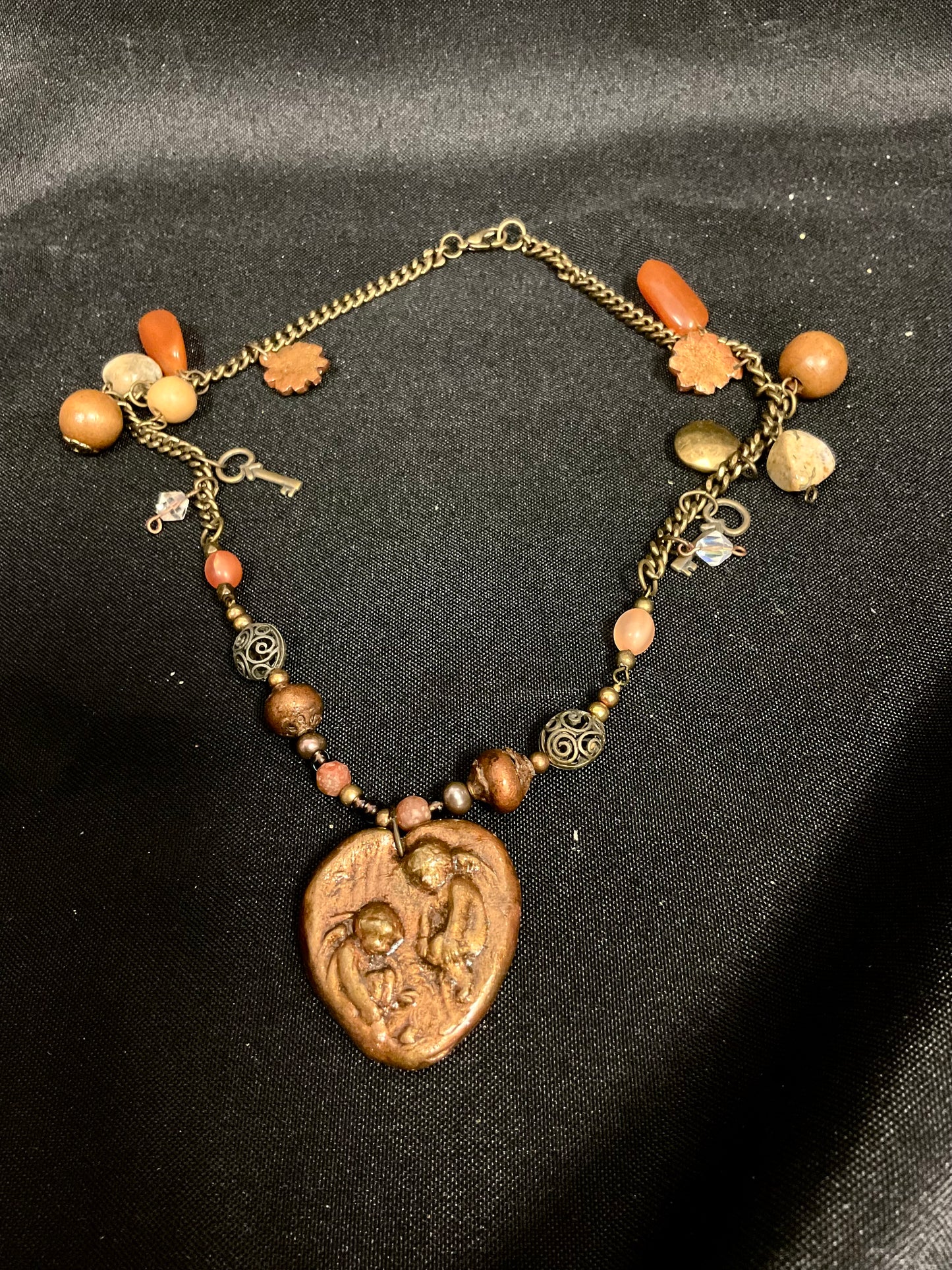 Brown Beaded Necklace with Fossil Angels Pendant