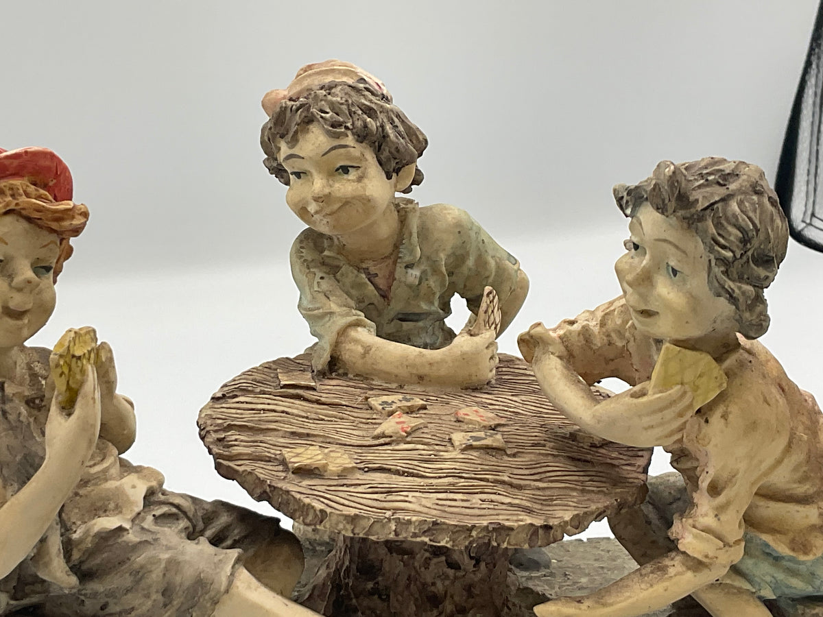 vintage resin sculpture titled "The Cheats" (or "The Cheaters") from the Misubanti Collection