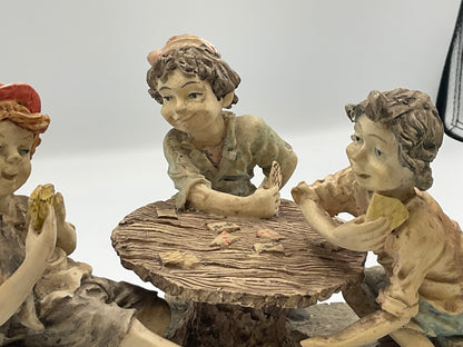 vintage resin sculpture titled "The Cheats" (or "The Cheaters") from the Misubanti Collection