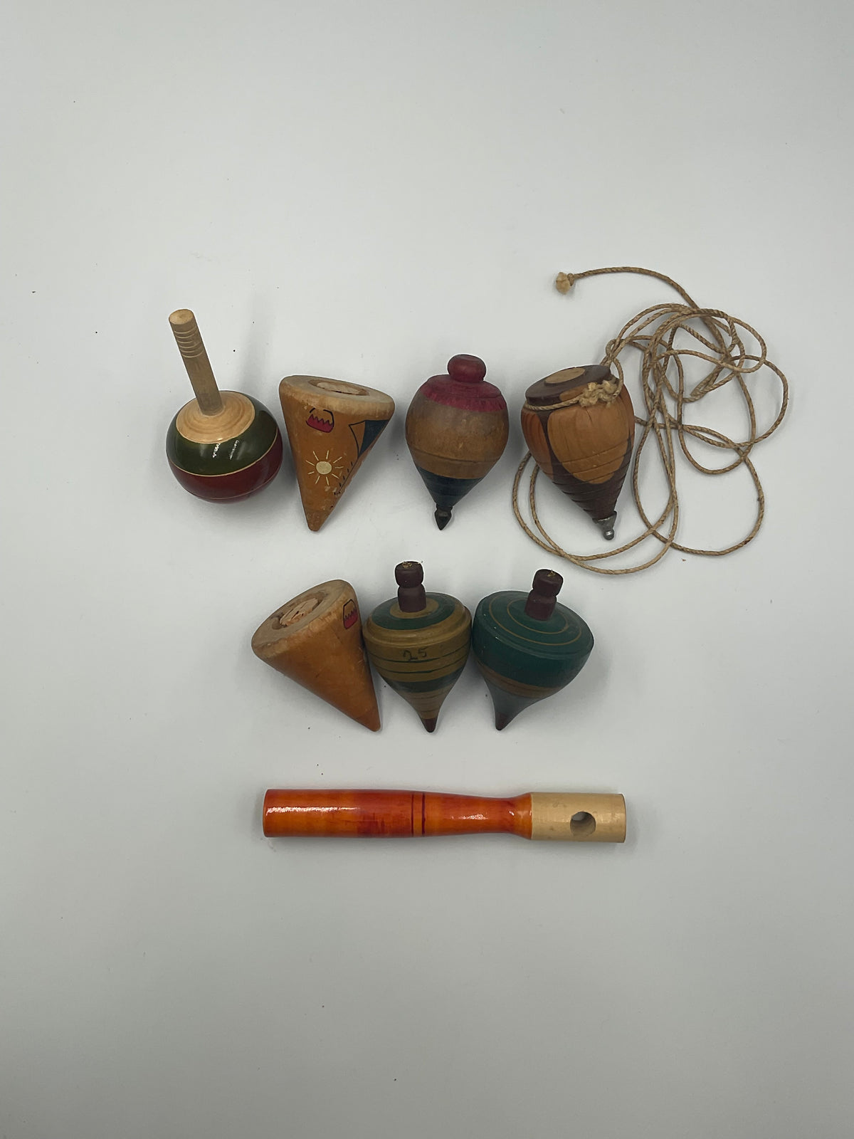 of vintage hand-turned wooden spinning tops