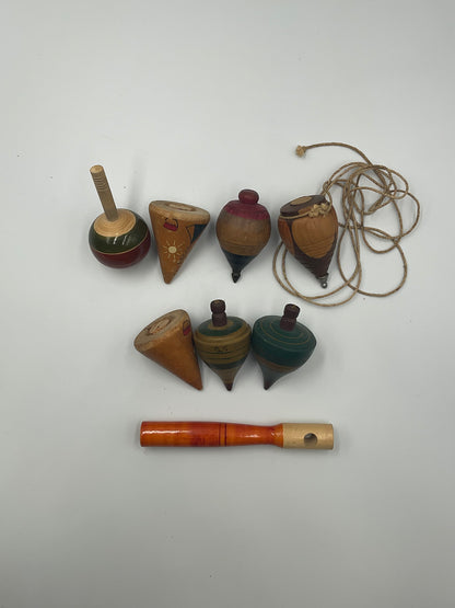 of vintage hand-turned wooden spinning tops
