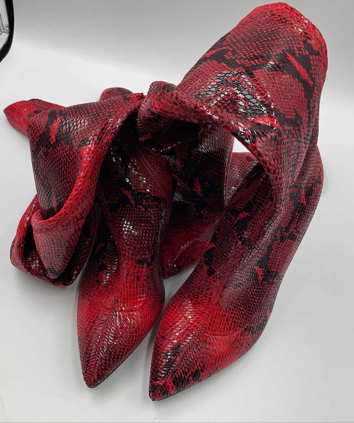 Mei Oi snakeskin-pattern over-the-knee boots