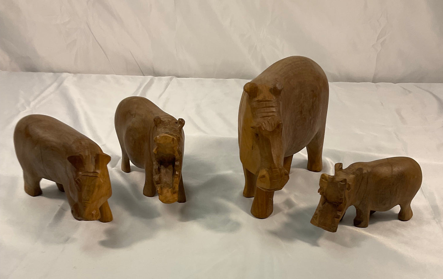 Genuine Besmo Wood Carvings Set of Four Hand-Carved Wooden Hippos Made in Kenya