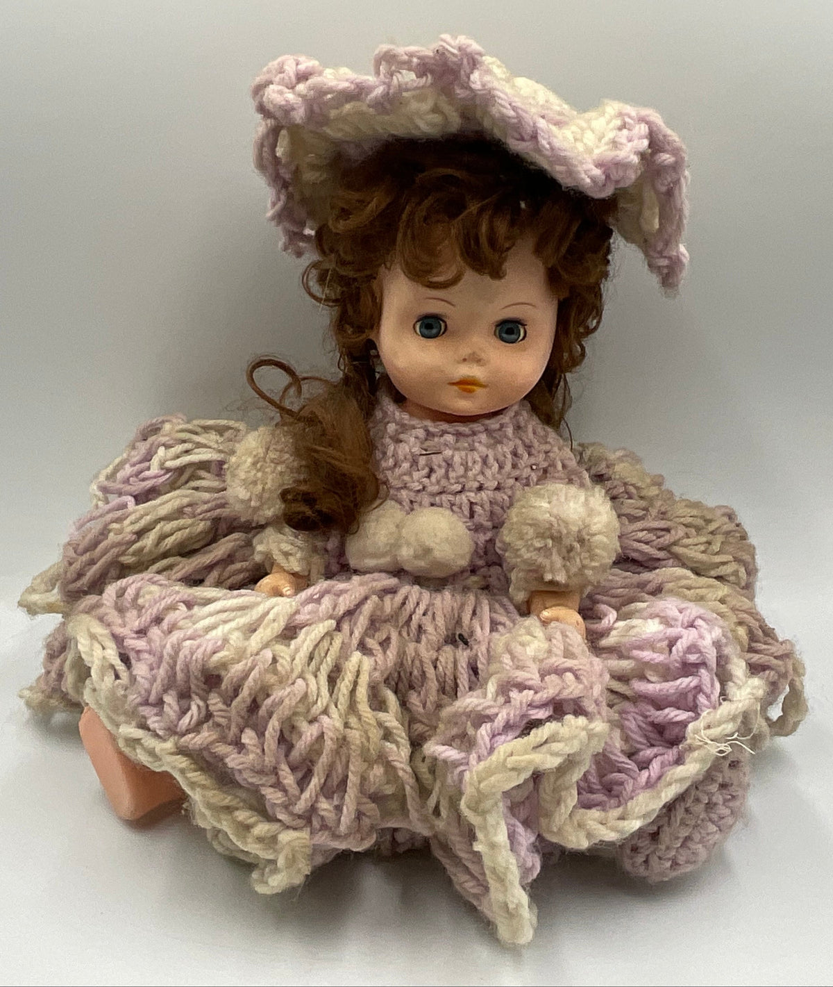 Vintage doll featuring a custom, handmade crochet dress and bonnet