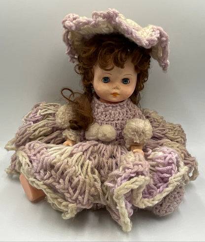 Vintage doll featuring a custom, handmade crochet dress and bonnet