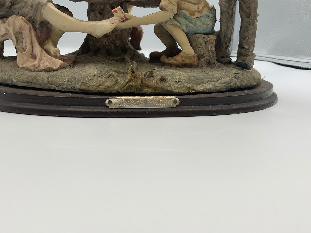 vintage resin sculpture titled "The Cheats" (or "The Cheaters") from the Misubanti Collection