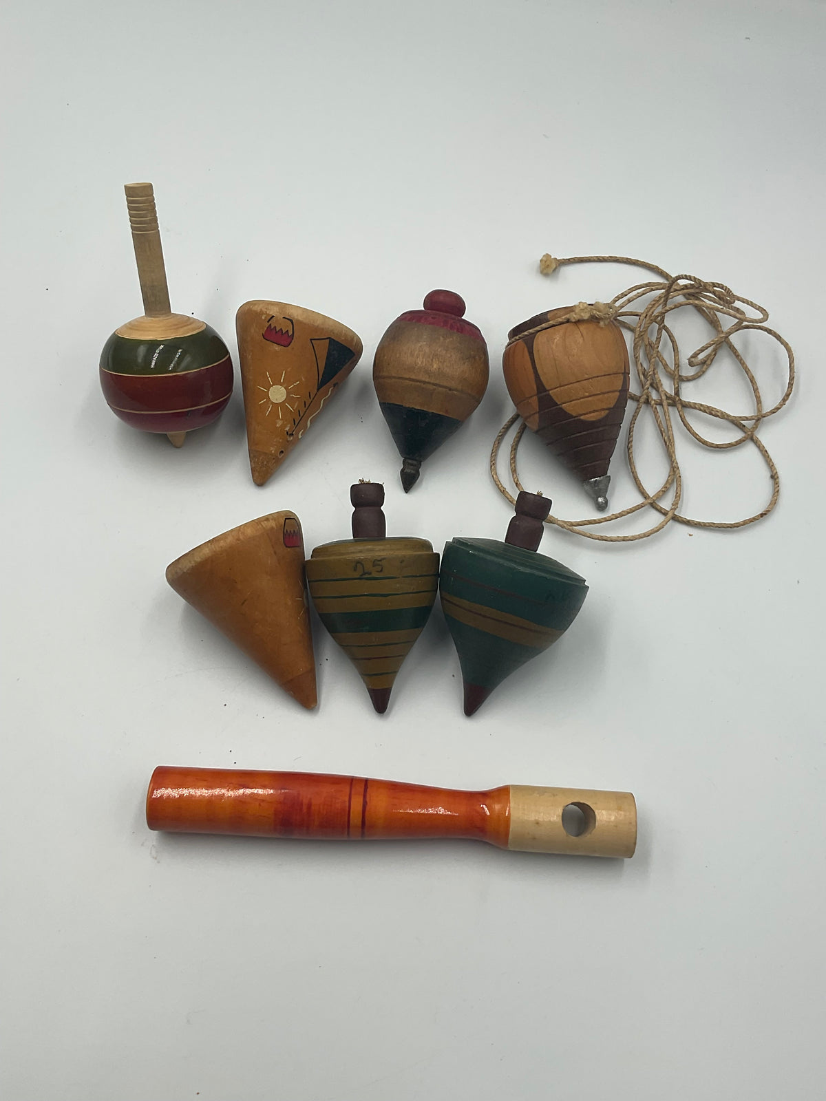 of vintage hand-turned wooden spinning tops