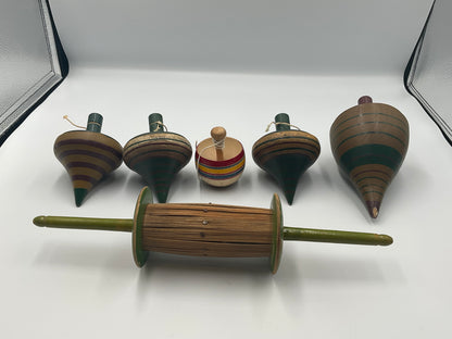 of vintage hand-turned wooden spinning tops