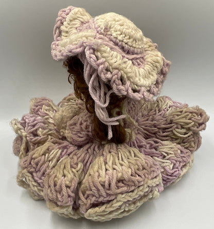 Vintage doll featuring a custom, handmade crochet dress and bonnet
