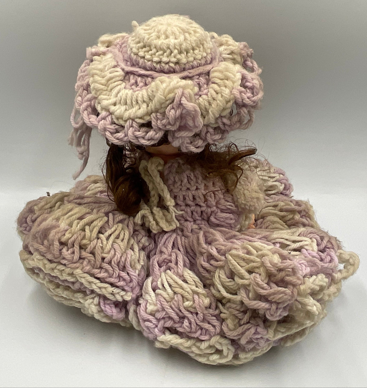Vintage doll featuring a custom, handmade crochet dress and bonnet