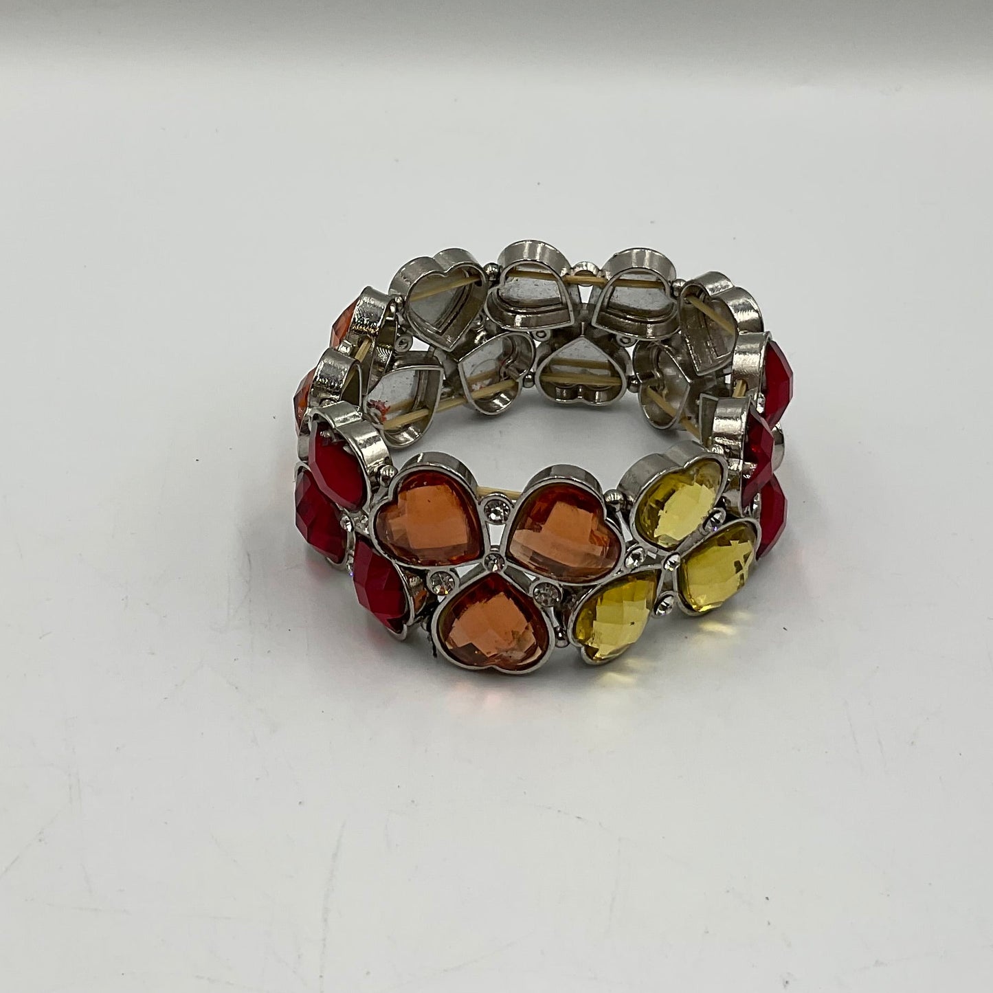 Silver Toned Bracelet With Colored Heart Shaped Stones