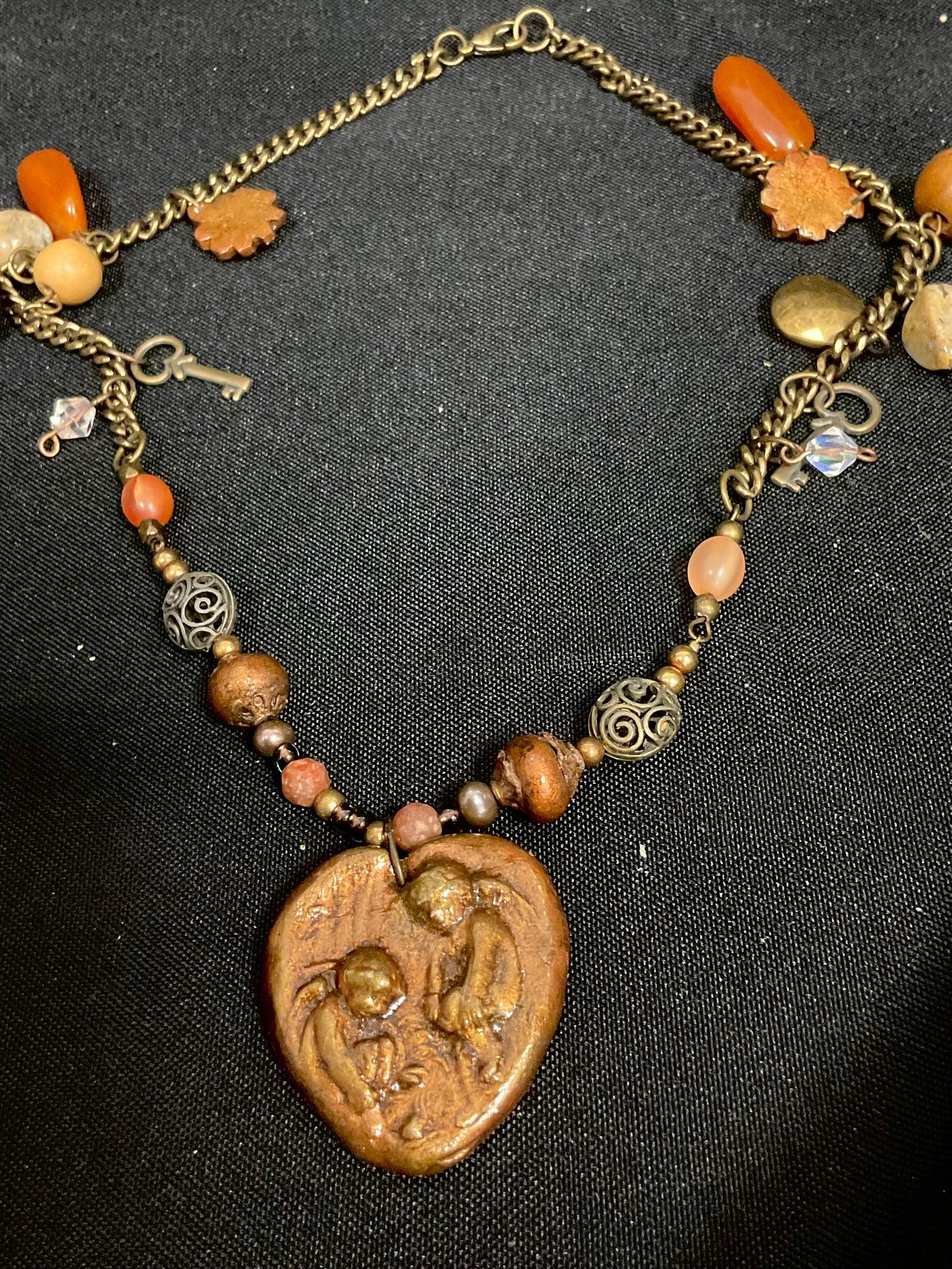 Brown Beaded Necklace with Fossil Angels Pendant