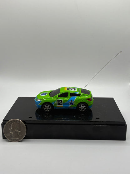 Westminister World's Smallest RC Car #12 Green Diecast 1:64 Size in Acrylic Case.