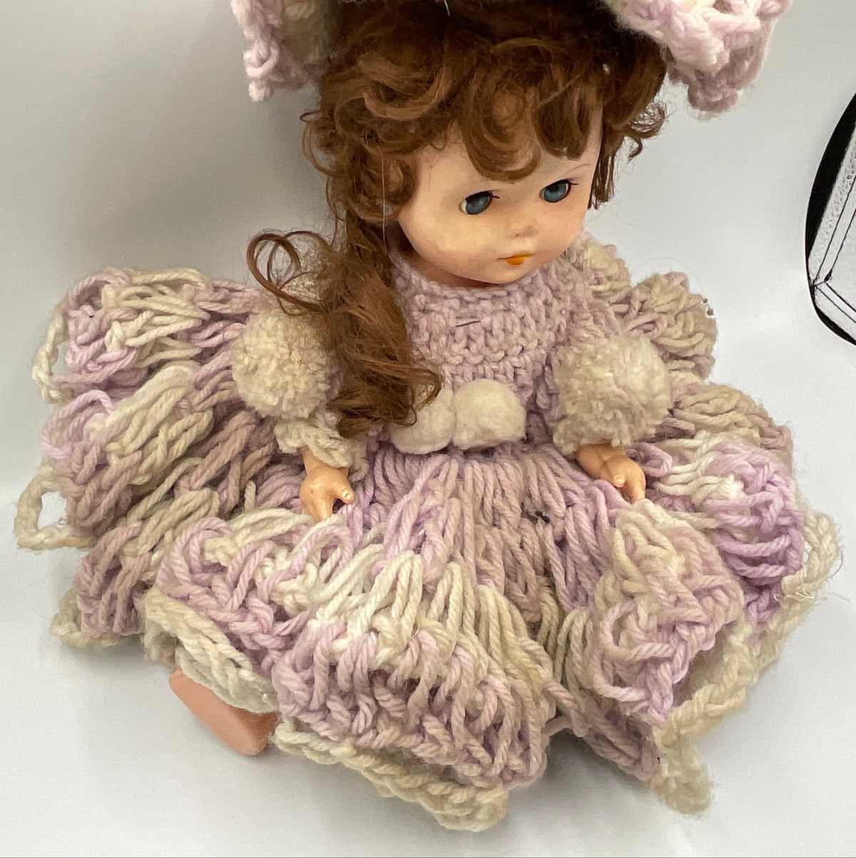 Vintage doll featuring a custom, handmade crochet dress and bonnet
